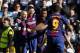 TOPSHOT - Barcelona's Argentinian forward Lionel Messi (2L) celebrates with Barcelona's Spanish midfielder Andres Iniesta, Barcelona's Brazilian midfielder Paulinho and Barcelona's Uruguayan forward Luis Suarez after scoring during the Spanish League 'Clasico' football match Real Madrid CF vs FC Barcelona at the Santiago Bernabeu stadium in Madrid on December 23, 2017. / AFP PHOTO / OSCAR DEL POZO (Photo credit should read OSCAR DEL POZO/AFP/Getty Images)