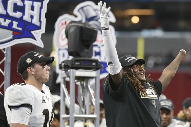 Central Florida linebacker Shaquem Griffin, right, and Central Florida quarterback McKenzie Milton (10) celebrate after the Peach Bowl NCAA college football game against Auburn, Monday, Jan. 1, 2018, in Atlanta. Central Florida won 34-27. (AP Photo/John Bazemore)
