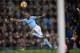 Manchester City's English midfielder Raheem Sterling heads wide during the English Premier League football match between Manchester City and Watford at the Etihad Stadium in Manchester, north west England, on January 2, 2018. / AFP PHOTO / Paul ELLIS / RESTRICTED TO EDITORIAL USE. No use with unauthorized audio, video, data, fixture lists, club/league logos or 'live' services. Online in-match use limited to 75 images, no video emulation. No use in betting, games or single club/league/player publications. / (Photo credit should read PAUL ELLIS/AFP/Getty Images)