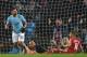 Manchester City's Argentinian striker Sergio Aguero scores their third goal past Watford's Brazilian goalkeeper Heurelho Gomes (2R) during the English Premier League football match between Manchester City and Watford at the Etihad Stadium in Manchester, north west England, on January 2, 2018. / AFP PHOTO / Paul ELLIS / RESTRICTED TO EDITORIAL USE. No use with unauthorized audio, video, data, fixture lists, club/league logos or 'live' services. Online in-match use limited to 75 images, no video emulation. No use in betting, games or single club/league/player publications. / (Photo credit should read PAUL ELLIS/AFP/Getty Images)