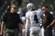 Oakland Raiders quarterback Derek Carr (4) talks with Oakland Raiders head coach Jack Del Rio, left, and offensive coordinator Todd Downing, right, before an NFL football game against the Los Angeles Chargers, Sunday, Dec. 31, 2017, in Carson, Calif. (AP Photo/Kelvin Kuo)