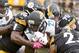 Pittsburgh Steelers defensive end L.T. Walton (96), outside linebacker T.J. Watt (90) and free safety Mike Mitchell (23) stop Jacksonville Jaguars running back Leonard Fournette (27) during an NFL football game, Sunday, Oct. 8, 2017, in Pittsburgh. (AP Photo/Fred Vuich)