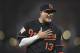 Baltimore Orioles' Manny Machado reacts to something from the bench of the Tampa Bay Rays before a baseball game, Friday, Sept. 22, 2017, in Baltimore. (AP Photo/Gail Burton)