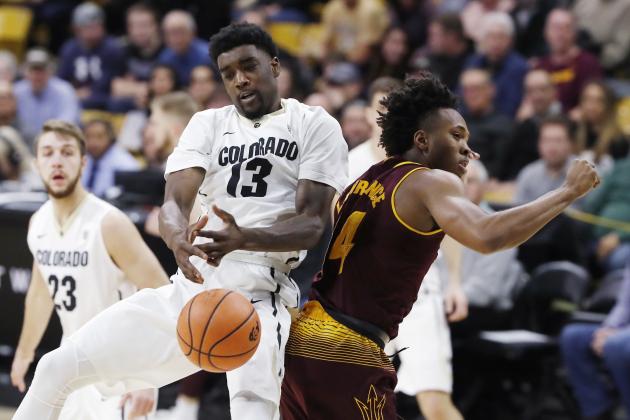 Colorado guard Namon Wright, left, struggles to pull in a rebound as he collides with Arizona State forward Kimani Lawrence during the first half of an NCAA college basketball game Thursday, Jan. 4, 2018, in Boulder, Colo. (AP Photo/David Zalubowski)