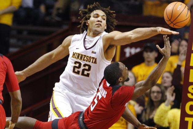 Minnesota center Reggie Lynch (22) tries to block a shot by Rutgers guard Mike Williams (5) during the second half of an NCAA college basketball game Sunday, Dec. 3, 2017, in Minneapolis. Minnesota won 89-67. (AP Photo/Bruce Kluckhohn)