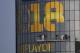 Workers place signage on a hotel announcing the NCAA national championship football game, Wednesday, Jan. 3, 2018, in Atlanta. Alabama and Georgia won their College Football Playoff semifinals on Monday and will meet in the national championship next week in Atlanta. (AP Photo/Mike Stewart)