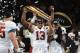 ATLANTA, GA - JANUARY 08: Tua Tagovailoa #13 of the Alabama Crimson Tide holds the trophy while celebrating with his team after defeating the Georgia Bulldogs in overtime to win the CFP National Championship presented by AT&T at Mercedes-Benz Stadium on January 8, 2018 in Atlanta, Georgia. (Photo by Mike Ehrmann/Getty Images)
