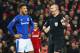 LIVERPOOL, ENGLAND - JANUARY 05: Referee Robert Madley points to the spot as he awards a penalty against Mason Holgate of Everton (L) during the Emirates FA Cup Third Round match between Liverpool and Everton at Anfield on January 5, 2018 in Liverpool, England. (Photo by Clive Brunskill/Getty Images)