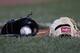 Two gloves lay on the infield prior to a baseball game at Fenway Park in Boston, Tuesday, July 18, 2017. (AP Photo/Charles Krupa)