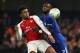 LONDON, ENGLAND - JANUARY 10: Alex Iwobi of Arsenal competes with Antonio Rudiger of Chelsea during the Carabao Cup Semi-Final first leg match between Chelsea and Arsenal at Stamford Bridge on January 10, 2018 in London, England. (Photo by Matthew Ashton - AMA/Getty Images)