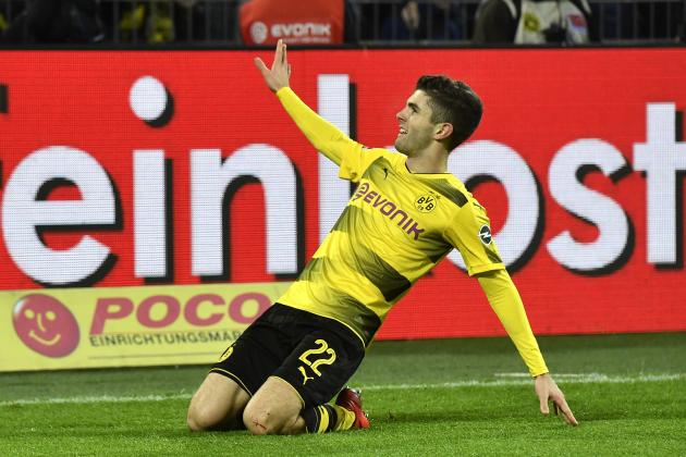 Dortmund's Christian Pulisic celebrates after he scored his side's second goal during the German Bundesliga soccer match between Borussia Dortmund and TSG Hoffenheim in Dortmund, Germany, Saturday, Dec. 16, 2017. Dortmund defeated Hoffenheim with 2-1. (AP Photo/Martin Meissner)