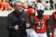 In this Saturday, Sept. 3, 2016 photo, Oklahoma State's Glenn Spencer, defensive coordinator, watches warm-ups before an NCAA college football game against Southeastern Louisiana in Stillwater, Okla. (AP Photo/Sue Ogrocki)