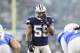 ARLINGTON, TX - NOVEMBER 23: Anthony Hitchens #59 of the Dallas Cowboys looks over the offense at the line of scrimmage during a game against the Los Angeles Chargers at AT&T Stadium on November 23, 2017 in Arlington, Texas. The Chargers defeated the Cowboys 28-6. (Photo by Wesley Hitt/Getty Images)