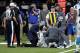 Carolina Panthers quarterback Cam Newton (1) is tended to by medical personnel after being sacked in the second half of an NFL football game against the New Orleans Saints in New Orleans, Sunday, Jan. 7, 2018. (AP Photo/Bill Feig)