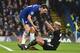Chelsea's Danish defender Andreas Christensen (L) remonstrates with Leicester City's Algerian midfielder Riyad Mahrez (R) after Mahrez went down in the area during the English Premier League football match between Chelsea and Leicester City at Stamford Bridge in London on January 13, 2018. / AFP PHOTO / Glyn KIRK / RESTRICTED TO EDITORIAL USE. No use with unauthorized audio, video, data, fixture lists, club/league logos or 'live' services. Online in-match use limited to 75 images, no video emulation. No use in betting, games or single club/league/player publications. / (Photo credit should read GLYN KIRK/AFP/Getty Images)