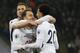 Tottenham Hotspur's Danish midfielder Christian Eriksen (C) celebrates with Tottenham Hotspur's English midfielder Dele Alli (R) and Tottenham Hotspur's English striker Harry Kane, scoring the team's fourth goal during the English Premier League football match between Tottenham Hotspur and Everton at Wembley Stadium in London, on January 13, 2018. / AFP PHOTO / Ian KINGTON / RESTRICTED TO EDITORIAL USE. No use with unauthorized audio, video, data, fixture lists, club/league logos or 'live' services. Online in-match use limited to 75 images, no video emulation. No use in betting, games or single club/league/player publications. / (Photo credit should read IAN KINGTON/AFP/Getty Images)