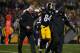PITTSBURGH, PA - DECEMBER 17: Antonio Brown #84 of the Pittsburgh Steelers is walked off the field by trainers after landing awkwardly while attempting to catch a pass in the second quarter during the game against the New England Patriots at Heinz Field on December 17, 2017 in Pittsburgh, Pennsylvania. (Photo by Justin K. Aller/Getty Images)