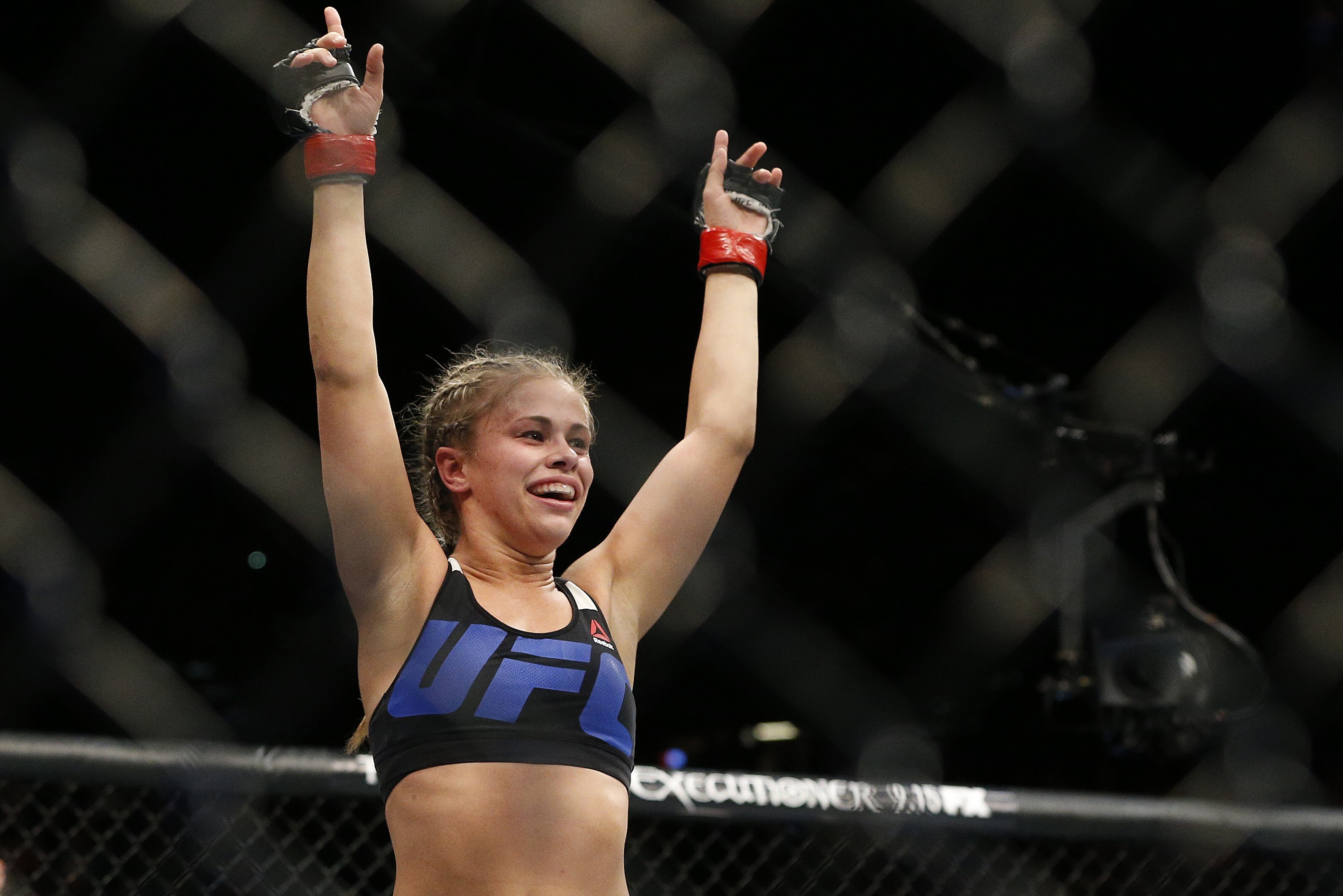 Paige VanZant celebrates after defeating Alex Chambers in their women’s straw weight mixed martial arts bout at UFC 191 on Saturday, Sept. 5, 2015, in Las Vegas. (AP Photo/John Locher)