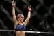Paige VanZant celebrates after defeating Alex Chambers in their women’s straw weight mixed martial arts bout at UFC 191 on Saturday, Sept. 5, 2015, in Las Vegas. (AP Photo/John Locher)