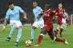 Liverpool's Senegalese midfielder Sadio Mane (R) takes on Manchester City's English defender Kyle Walker (L) and Manchester City's Brazilian midfielder Fernandinho (C) during the English Premier League football match between Liverpool and Manchester City at Anfield in Liverpool, north west England on January 14, 2018. / AFP PHOTO / Oli SCARFF / RESTRICTED TO EDITORIAL USE. No use with unauthorized audio, video, data, fixture lists, club/league logos or 'live' services. Online in-match use limited to 75 images, no video emulation. No use in betting, games or single club/league/player publications. / (Photo credit should read OLI SCARFF/AFP/Getty Images)