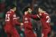 Liverpool's Egyptian midfielder Mohamed Salah (C) celebrates scoring their fourth goal to make the score 4-1 with team-mates Liverpool's Scottish defender Andrew Robertson (R) and Liverpool's German midfielder Emre Can (L) during the English Premier League football match between Liverpool and Manchester City at Anfield in Liverpool, north west England on January 14, 2018. / AFP PHOTO / Oli SCARFF / RESTRICTED TO EDITORIAL USE. No use with unauthorized audio, video, data, fixture lists, club/league logos or 'live' services. Online in-match use limited to 75 images, no video emulation. No use in betting, games or single club/league/player publications. / (Photo credit should read OLI SCARFF/AFP/Getty Images)