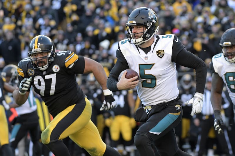 Jacksonville Jaguars quarterback Blake Bortles (5) scrambles out of the pocket during the second half of an NFL divisional football AFC playoff game in Pittsburgh, Sunday, Jan. 14, 2018. (AP Photo/Don Wright)