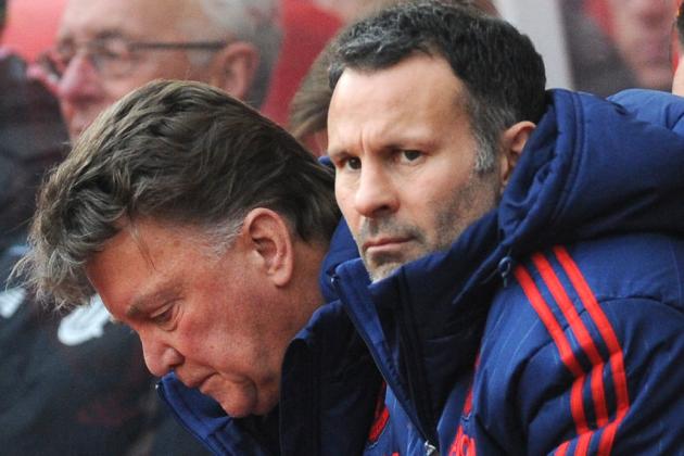 FILE - This is a Saturday, Dec. 26, 2015 file photo of Manchester United assistant manager Ryan Giggs, foreground, and manager Louis van Gaal, swatch the English Premier League soccer match between Stoke City and Manchester United at the Britannia Stadium, Stoke on Trent, England. Ryan Giggs Friday July 1, 2016 ended his 29-year association with Manchester United, leaving the coaching staff at the fallen Premier League powers at the start of Jose Mourinho’s reign. The 42-year-old Giggs joined United in 1987 as a 14-year-old went on to play a record 963 times for the first team, mostly under Alex Ferguson.(AP Photo/Rui Vieira, File)