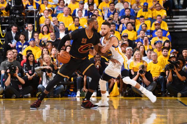 OAKLAND, CA - JUNE 12:  LeBron James #23 of the Cleveland Cavaliers handles the ball against Stephen Curry #30 of the Golden State Warriors in Game Five of the 2017 NBA Finals on June 12, 2017 at ORACLE Arena in Oakland, California. NOTE TO USER: User expressly acknowledges and agrees that, by downloading and/or using this photograph, user is consenting to the terms and conditions of Getty Images License Agreement. Mandatory Copyright Notice: Copyright 2017 NBAE (Photo by Andrew D. Bernstein/NBAE via Getty Images)