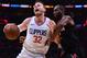 LOS ANGELES, CA - JANUARY 15: Blake Griffin #32 of the LA Clippers reacts as he posts up Luc Mbah a Moute #12 of the Houston Rockets during a 113-102 Clipper win at Staples Center on January 15, 2018 in Los Angeles, California. (Photo by Harry How/Getty Images)