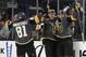 Vegas Golden Knights right wing Reilly Smith, center, celebrates after center William Karlsson, right, scored against the Toronto Maple Leafs during the first period of an NHL hockey game Sunday, Dec. 31, 2017, in Las Vegas. (AP Photo/John Locher)