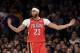 New Orleans Pelicans' Anthony Davis reacts after sinking the tying shot during the second half of the NBA basketball game against the New York Knicks, Sunday, Jan. 14, 2018, in New York. The Pelicans defeated the Knicks in overtime 123-118 (AP Photo/Seth Wenig)