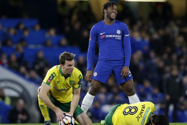 Chelsea's Michy Batshuayi, center, reacts after duel with Norwich City's Christoph Zimmermann, left, and Mario Vrancic during the English FA Cup third round replay between Chelsea and Norwich City at the Stamford Bridge, in London, Wednesday, Jan. 17, 2018. (AP Photo/Alastair Grant)