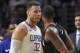 Los Angeles Clippers forward Blake Griffin, left, and Houston Rockets forward Trevor Ariza have words before both of them were ejected in the closing seconds of an NBA basketball game, Monday, Jan. 15, 2018, in Los Angeles. The Clippers won 113-102. (AP Photo/Mark J. Terrill)