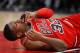 CHICAGO, IL - JANUARY 17: Kris Dunn #32 of the Chicago Bulls lays on the floor after suffering a mouth injury following a dunk against the Golden State Warriors at the United Center on January 17, 2018 in Chicago, Illinois. The Warriors defeated the Bulls 119-112. NOTE TO USER: User expressly acknowledges and agrees that, by downloading and or using this photograph, User is consenting to the terms and conditions of the Getty Images License Agreement. (Photo by Jonathan Daniel/Getty Images)
