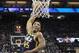 Utah Jazz guard Donovan Mitchell, left, goes up for the dunk against Sacramento Kings forward Zach Randolph during the second half of an NBA basketball game Wednesday, Jan. 17, 2018, in Sacramento, Calif. The Jazz won 120-105. (AP Photo/Rich Pedroncelli)