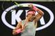 Spain's Rafael Nadal hits a return against Bosnia's Damir Dzumhur during their men's singles third round match on day five of the Australian Open tennis tournament in Melbourne on January 19, 2018. / AFP PHOTO / SAEED KHAN / -- IMAGE RESTRICTED TO EDITORIAL USE - STRICTLY NO COMMERCIAL USE -- (Photo credit should read SAEED KHAN/AFP/Getty Images)