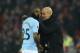 Manchester City's Spanish manager Pep Guardiola (R) talks with Manchester City's Brazilian midfielder Fernandinho (L) on the touchliner during the English Premier League football match between Liverpool and Manchester City at Anfield in Liverpool, north west England on January 14, 2018. / AFP PHOTO / Oli SCARFF / RESTRICTED TO EDITORIAL USE. No use with unauthorized audio, video, data, fixture lists, club/league logos or 'live' services. Online in-match use limited to 75 images, no video emulation. No use in betting, games or single club/league/player publications. / (Photo credit should read OLI SCARFF/AFP/Getty Images)