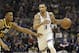 Sacramento Kings guard George Hill, right, drives against Utah Jazz guard Donovan Mitchell during the first quarter of an NBA basketball game Wednesday, Jan. 17, 2018, in Sacramento, Calif. (AP Photo/Rich Pedroncelli)