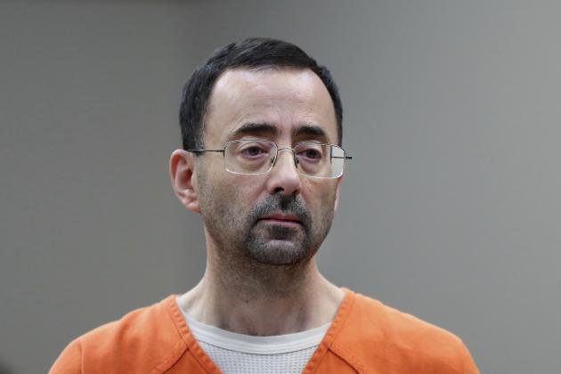 In this Nov. 22, 2017 file photo, Dr. Larry Nassar, 54, appears in court for a plea hearing in Lansing, Mich. Nasser, a sports doctor accused of molesting girls while working for USA Gymnastics and Michigan State University pleaded, guilty to multiple charges of sexual assault and will face at least 25 years in prison.(AP Photo/Paul Sancya)