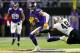 MINNEAPOLIS, MN - JANUARY 14: Adam Thielen #19 of the Minnesota Vikings breaks a tackle from Vonn Bell #48 of the New Orleans Saints during the first half of the NFC Divisional Playoff game at U.S. Bank Stadium on January 14, 2018 in Minneapolis, Minnesota. (Photo by Jamie Squire/Getty Images)