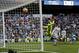 Real Madrid's Gareth Bale, background second right, scores past Deportivo Coruna's goalkeeper Ruben Martinez his team's second goal during a Spanish La Liga soccer match between Real Madrid and Deportivo Coruna at the Santiago Bernabeu stadium in Madrid, Sunday, Jan. 21, 2018. (AP Photo/Francisco Seco)