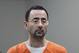 In this Nov. 22, 2017 file photo, Dr. Larry Nassar, 54, appears in court for a plea hearing in Lansing, Mich. Nasser, a sports doctor accused of molesting girls while working for USA Gymnastics and Michigan State University pleaded, guilty to multiple charges of sexual assault and will face at least 25 years in prison.(AP Photo/Paul Sancya)