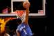 DENVER, CO - JANUARY 16: Dennis Smith Jr. #1 of the Dallas Mavaricks dunks against Nikola Jokic #15 and Gary Harris #14 of the Denver Nuggets at the Pepsi Center on January 16, 2018 in Denver, Colorado. NOTE TO USER: User expressly acknowledges and agrees that, by downloading and or using this photograph, User is consenting to the terms and conditions of the Getty Images License Agreement. (Photo by Matthew Stockman/Getty Images)