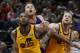 Los Angeles Clippers forward Blake Griffin, rear, battle under the boards with Utah Jazz&#39;s Derrick Favors (15) and Joe Ingles (2) in the first half during an NBA basketball game Saturday, Jan. 20, 2018, in Salt Lake City. (AP Photo/Rick Bowmer)