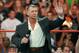 LAS VEGAS - AUGUST 24: World Wrestling Entertainment Inc. Chairman Vince McMahon appears in the ring during the WWE Monday Night Raw show at the Thomas & Mack Center August 24, 2009 in Las Vegas, Nevada. (Photo by Ethan Miller/Getty Images)