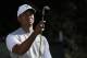 Tiger Woods waits to hit on the 11th hole of the South Course at Torrey Pines Golf Course during the third round of the Farmers Insurance Open golf tournament, Saturday, Jan. 27, 2018, in San Diego. (AP Photo/Gregory Bull)