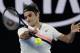 Switzerland's Roger Federer makes a forehand return to South Korea's Hyeon Chung during their semifinal at the Australian Open tennis championships in Melbourne, Australia, Friday, Jan. 26, 2018. (AP Photo/Dita Alangkara)