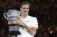 Switzerland's Roger Federer holds his trophy after defeating Croatia's Marin Cilic in the men's singles final at the Australian Open tennis championships in Melbourne, Australia, Sunday, Jan. 28, 2018. (AP Photo/Dita Alangkara)