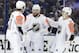 Pacific Division's Drew Doughty, center, of the Los Angeles Kings, is congratulated by Anze Kopitar (11), of the Los Angeles Kings, and Rickard Rakell, of the Anaheim Ducks (67), after scoring during the NHL hockey All-Star game with the Atlantic Division Sunday, Jan. 28, 2018 in Tampa, Fla. (AP Photo/Chris O'Meara)
