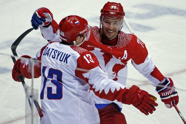 FILE - This is a Saturday, Feb. 15, 2014 file photo of Russia forward Ilya Kovalchuk, right, as he  celebrates with forward Pavel Datsyuk after Datsyuk scored against the USA in the second period of a men's ice hockey game at the 2014 Winter Olympics in Sochi, Russia. Former NHL players Pavel Datsyuk and Ilya Kovalchuk will lead the hockey team of the “Olympic Athletes from Russia” at the Pyeongchang Games. It’s the fifth Olympics for both Datsyuk and Kovalchuk. They will be on a team drawn entirely from the Russia-based Kontinental Hockey League. (AP Photo/Petr David Josek/File)